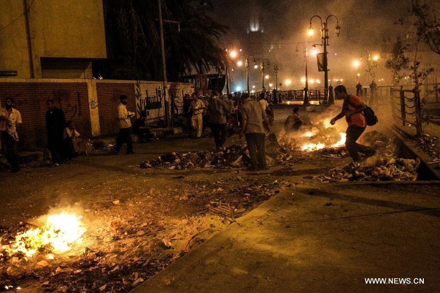 Supporters of ousted Egyptian President Mohamed Morsi are seen in Ramsis square, downtown Cairo, Egypt on July 15, 2013. Clashes erupted between pro-Morsi protesters and riot police when police force fired teargas and rubber bullets at a pro-Morsi march heading to Giza square, at least 100 protesters are injured, according the official Egyptian Ambulance Organization. (Xinhua/Amru Salahuddien)