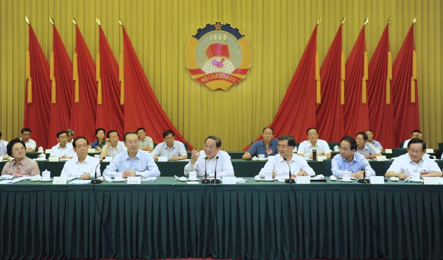 Yu Zhengsheng (C, front), a member of the Standing Committee of the Political Bureau of the Communist Party of China (CPC) Central Committee and chairman of the National Committee of the Chinese People's Political Consultative Conference (CPPCC), attends a meeting held by the CPPCC National Committee on coordinated development in urbanization as well as raising the quality of urbanization in Beijing, capital of China, July 16, 2013. (Xinhua/Xie Huanchi)