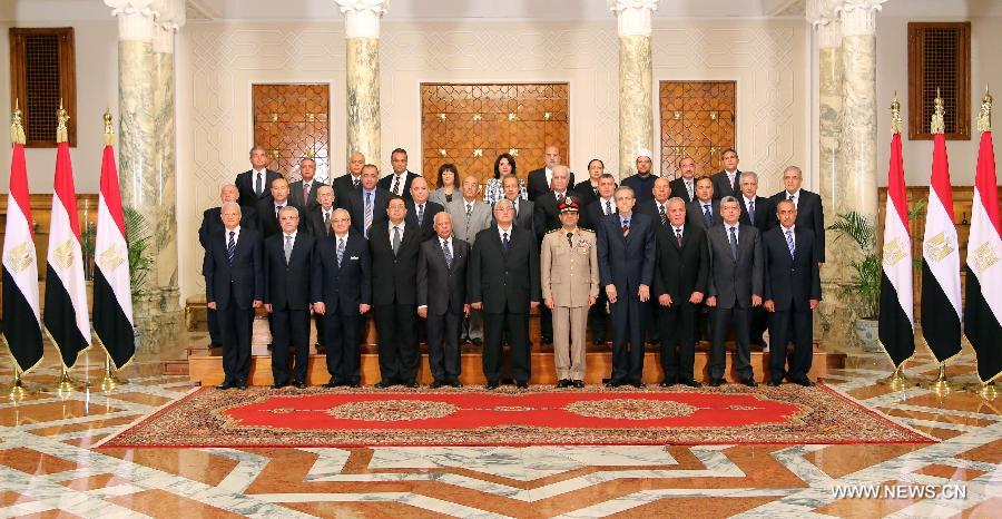 In this hand out picture released by the Egyptian presidency shows Egypt's interim president Adly Mansour (front C) and the newly sworn-in Egypt's interim cabinet pose for a group picture on July 16, 2013 in Cairo. Egypt's interim government, headed by Prime Minister Hazem Beblawi, was sworn in on Tuesday, with no one from Islamic parties included in the interim cabinet. (Xinhua/Egyptian Presidency)