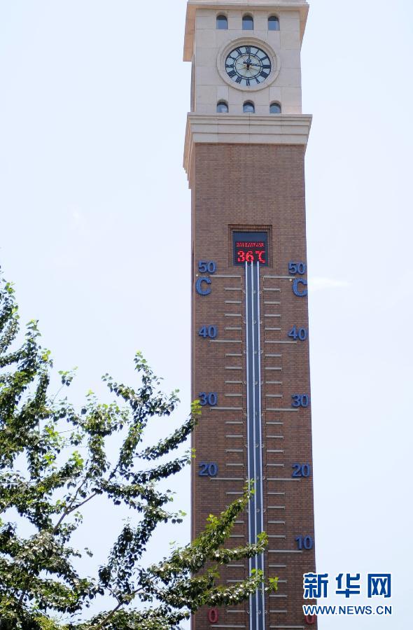 A thermometer on a belfry shows the temperature reaching 36 degrees Celsius at noon on July 3, 2013, in Shijiazhuang, capital of north China's Hebei province. The weather station of Hebei province issued a red warning for high temperature that day. (Xinhua/Liu Dawei)