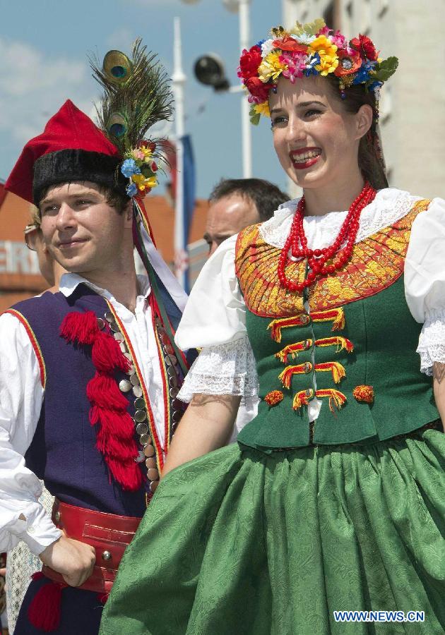 Participants from Poland perform during the 47th International Folklore Festival in Zagreb, capital of Croatia, on July 18, 2013. Around 900 participants of 29 art groups from Croatia and 11 other countries and regions took part in the five-day traditional festival. (Xinhua/Miso Lisanin)
