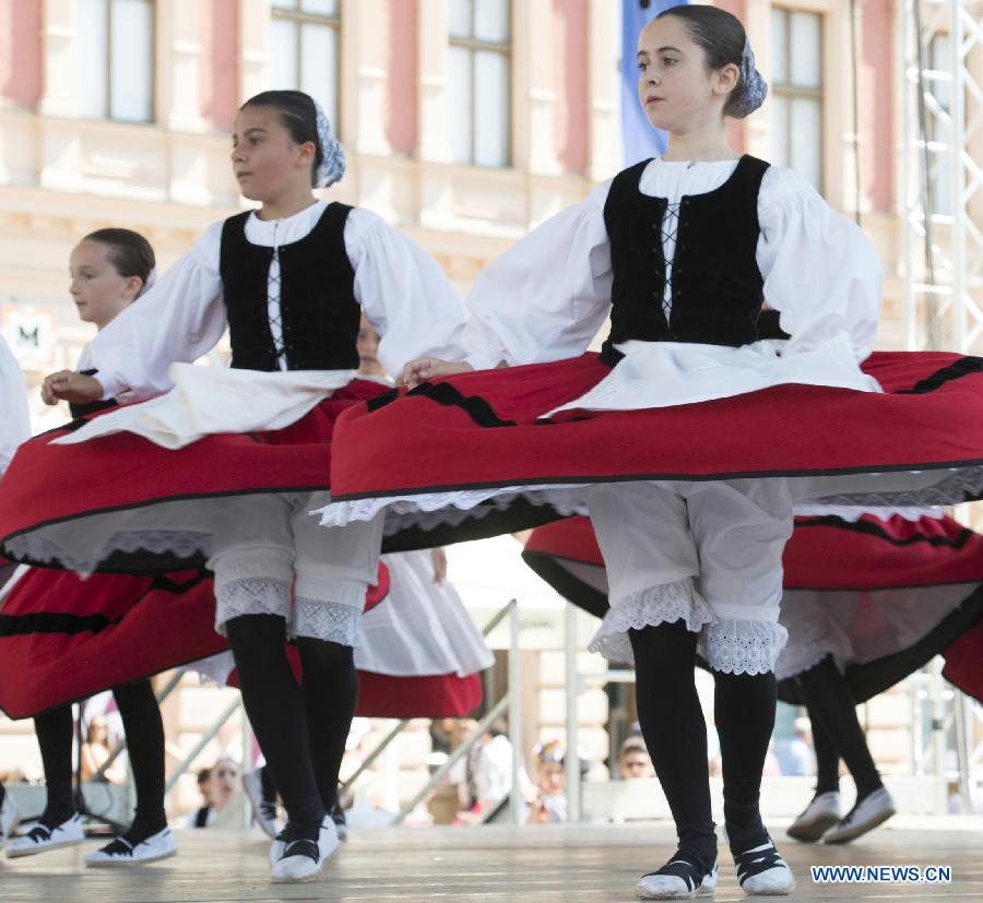 Participants from Spain perform during the 47th International Folklore Festival in Zagreb, capital of Croatia, on July 18, 2013. Around 900 participants of 29 art groups from Croatia and 11 other countries and regions took part in the five-day traditional festival. (Xinhua/Miso Lisanin)