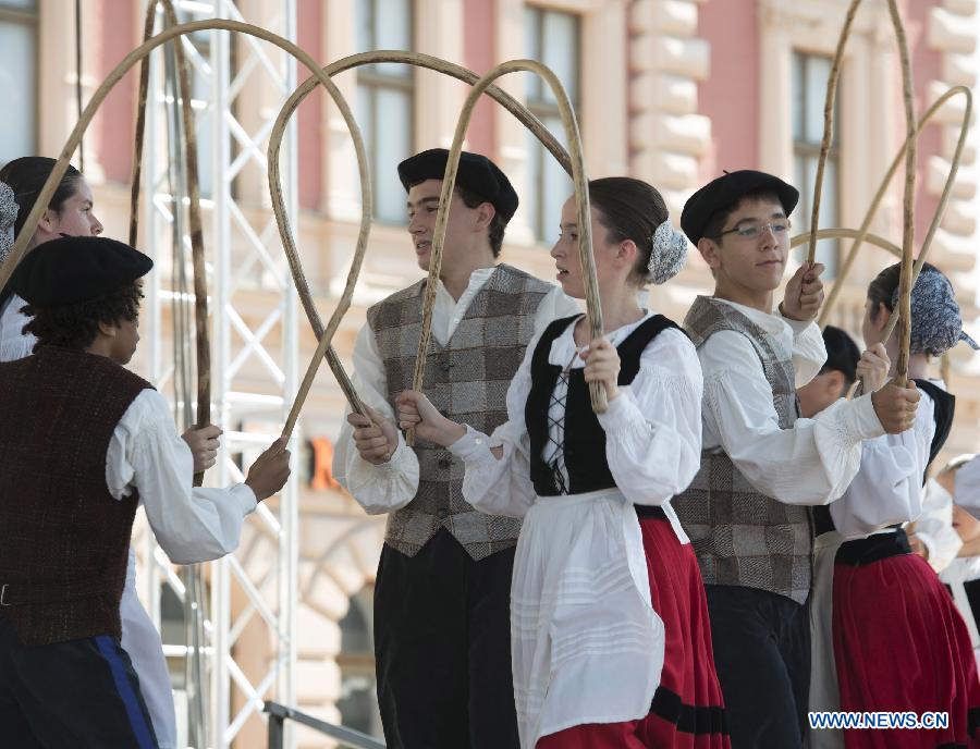 Participants from Spain perform during the 47th International Folklore Festival in Zagreb, capital of Croatia, on July 18, 2013. Around 900 participants of 29 art groups from Croatia and 11 other countries and regions took part in the five-day traditional festival. (Xinhua/Miso Lisanin)