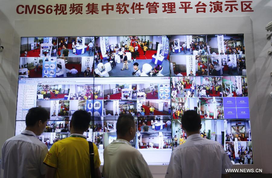Visitors view video software management platform at the 2013 China International Exhibition on Public Safety and Security in Beijing, capital of China, July 18, 2013. The exhibition kicked off on Thursday at China International Exhibition Center. (Xinhua/Zhao Bing) 