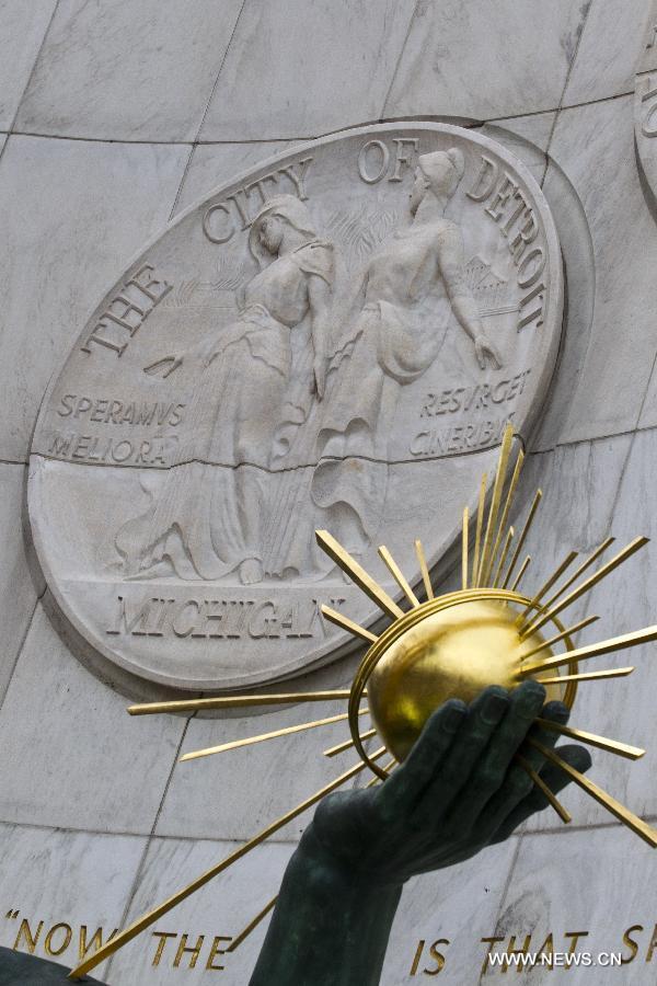 The "Spirit of Detroit" statue kneels guard in front of the City of Detroit Municipal building,in Detroit, Michigan, the United States, July 18, 2013. U.S. city Detroit filed for bankruptcy Thursday, making it the largest-ever municipal bankruptcy in U.S. history, local media reported. (Xinhua/Tony Ding) 