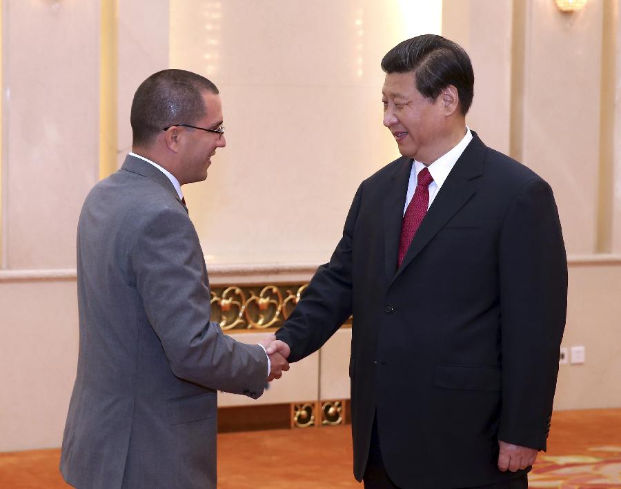 Chinese President Xi Jinping (R) meets with Venezuelan Vice President Jorge Arreaza at the Great Hall of the People in Beijing, capital of China, July 19, 2013. (Xinhua/Pang Xinglei)