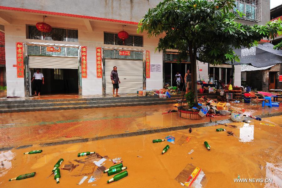 Photo taken on July 19, 2013 shows the flooded Shenwo Village of Gangwei Township in Longhai of Zhangzhou City, southeast China's Fujian Province. Tropical storm Cimaron made its landfall in Fujian Thursday evening, bringing heavy rain and strong gales to southern part of the province. Xiamen, Zhangzhou, Quanzhou and Putian were severely affected by the storm, with the rainfall in some regions like Longhai reaching 520 millimeters on Friday. About 123,000 residents were afflicted by the storm and no casualties have been reported yet. (Xinhua/Wei Peiquan) 