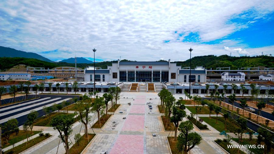 Photo taken on July 18, 2013 shows the finished Taining train station on Xiangtang-Putian Railway, or Xiangpu Railway, southeast China's Fujian Province. The 632-kilometer-long railway, which links Xiangtang Township in Nanchang, capital of east China's Jiangxi Province, and Putian City in Fujian, is expected to open to traffic by the end of this September after all debugging and commissioning finishes. The Xiangpu Railway, which will be one of the key transportation arteries for both travellers and goods in this area after it is opened to traffic, will also be the first railway running through seven districts and counties in Jiangxi and Fujian. (Xinhua/Chen Chunyuan)