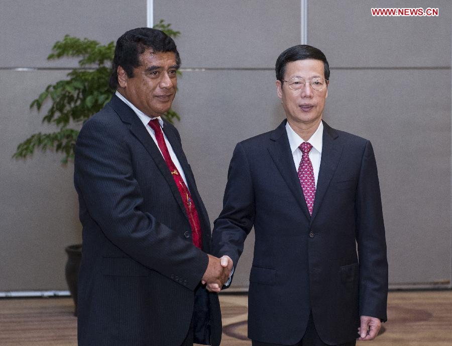 Chinese Vice Premier Zhang Gaoli (R), also a member of the Standing Committee of the Political Bureau of the Communist Party of China Central Committee, shakes hands with Tongan Prime Minister Siale'ataonga Tu'ivakano during their meeting at the Eco-Forum Global in Guiyang, capital of southwest China's Guizhou Province, July 19, 2013. The Eco-Forum Global is held from July 19 to July 21. (Xinhua/Wang Ye)