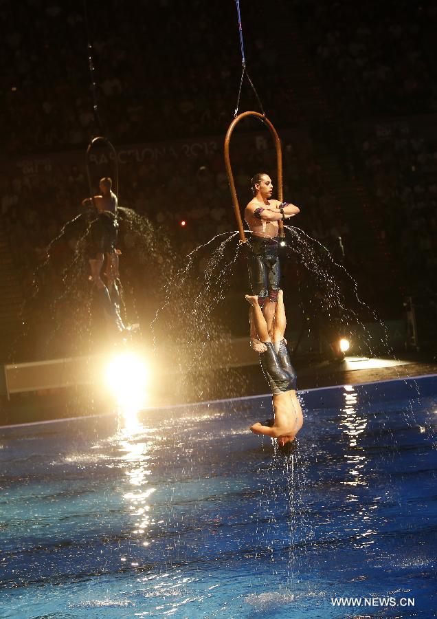 Acrobats perform during the Opening Ceremony of the 15th FINA World Championships at Palau Sant Jordi in Barcelona, Spain on July 19, 2013. (Xinhua/Wang Lili)