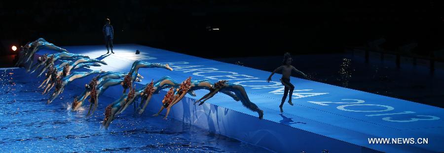 Swimmers perform during the Opening Ceremony of the 15th FINA World Championships at Palau Sant Jordi in Barcelona, Spain on July 19, 2013. (Xinhua/Wang Lili)