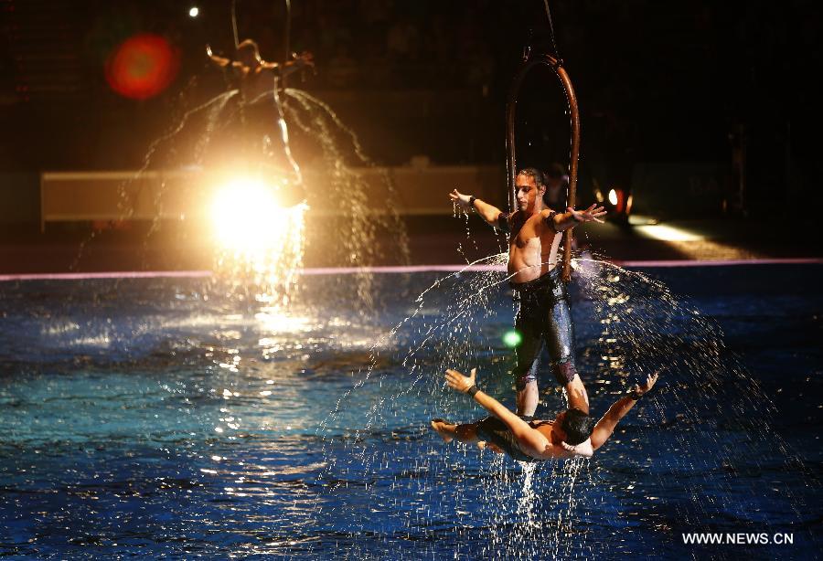 Acrobats perform during the Opening Ceremony of the 15th FINA World Championships at Palau Sant Jordi in Barcelona, Spain on July 19, 2013. (Xinhua/Wang Lili)