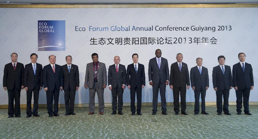 Chinese Vice Premier Zhang Gaoli (6th R), also a member of the Standing Committee of the Political Bureau of the Communist Party of China Central Committee, poses for a group picture with distinguished guests from home and abroad before the opening ceremony of the Eco Forum Global Annual Conference 2013 in Guiyang, capital of southwest China's Guizhou Province, July 20, 2013. Zhang read out Chinese President Xi Jinping's congratulatory letter on the opening of the conference and delivered a speech here on Saturday. (Xinhua/Wang Ye) 