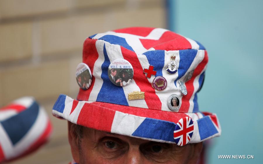 A cap of the royal fan Terry Hutt is pictured outside the Lindo Wing of St. Mary's hospital in London, July 20, 2013. The nation awaits news of a new royal baby. (Xinhua/Bimal Gautam) 