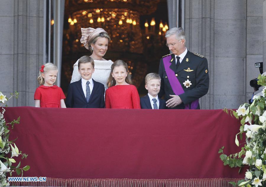 Belgium's newly sworn in King Philippe and his family meet the people from the balcony of Royal Palace in Brussels, capital of Belgium, on July 21, 2013, the country's national day. Prince Philippe was sworn in before parliament as Belgium's seventh king on Sunday, after his father Albert II abdicated. (Xinhua/Ye Pingfan)