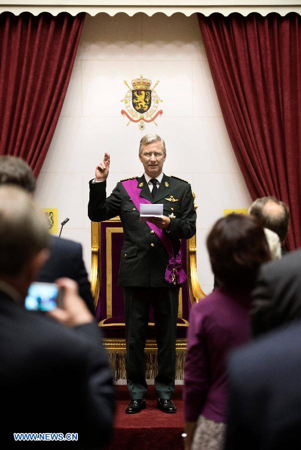 King Philippe of Belgium takes the oath during a ceremony at the Belgian Parliament in Brussels, on July 21, 2013. Prince Philippe was sworn in before parliament as Belgium's seventh king on Sunday, the country's national day, after his 79-year-old father Albert II abdicated. (Xinhua/POOL)