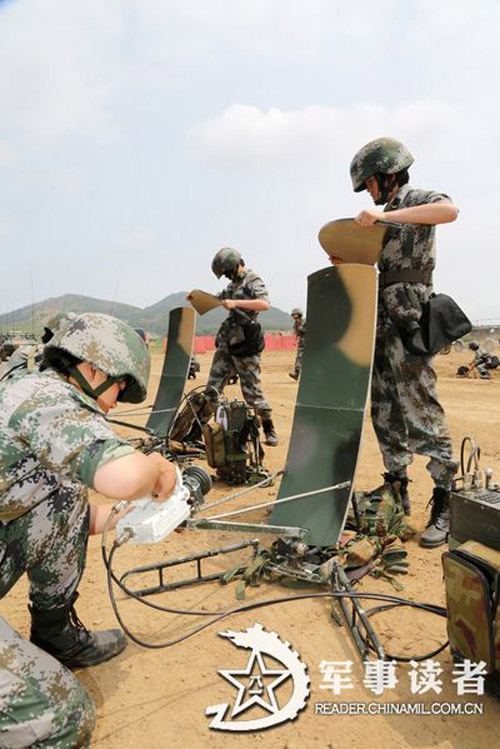 Female soldiers in a communication detachment of a brigade under the Jinan Military Area Command (MAC) of the Chinese People's Liberation Army (PLA) are in a communication exercises in a field training ground in mid July.  (China Military Online/Yu Hualiang, Yan Xiaohui, Jiang Honglin) 