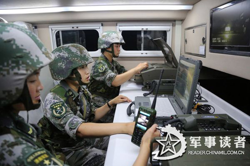 Female soldiers in a communication detachment of a brigade under the Jinan Military Area Command (MAC) of the Chinese People's Liberation Army (PLA) are in a communication exercises in a field training ground in mid July.  (China Military Online/Yu Hualiang, Yan Xiaohui, Jiang Honglin) 