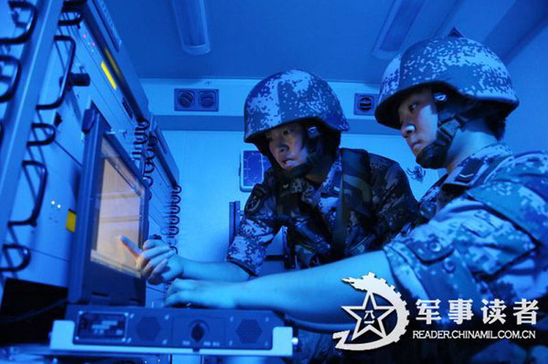 Female soldiers in a communication detachment of a brigade under the Jinan Military Area Command (MAC) of the Chinese People's Liberation Army (PLA) are in a communication exercises in a field training ground in mid July.  (China Military Online/Yu Hualiang, Yan Xiaohui, Jiang Honglin) 