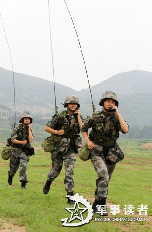 Female soldiers in a communication detachment of a brigade under the Jinan Military Area Command (MAC) of the Chinese People's Liberation Army (PLA) are in a communication exercises in a field training ground in mid July.  (China Military Online/Yu Hualiang, Yan Xiaohui, Jiang Honglin) 