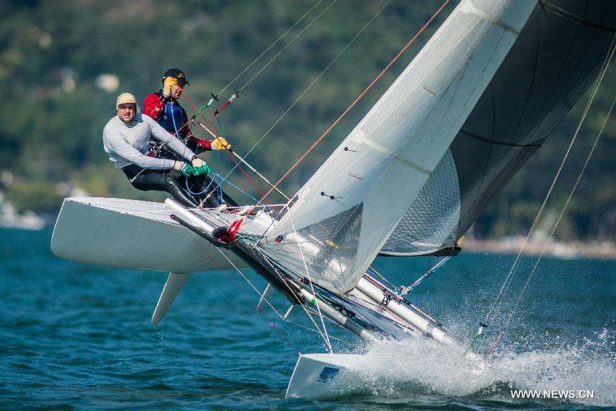 Competitors participate in Tornado Class in the Star class races in Sao Sebastiao Channel during the 40th International Sailing Week 2013 Ilhabela Monotypes in Ilhabela, Brazil, July 20, 2013. (Xinhua/Marcos Mendez)