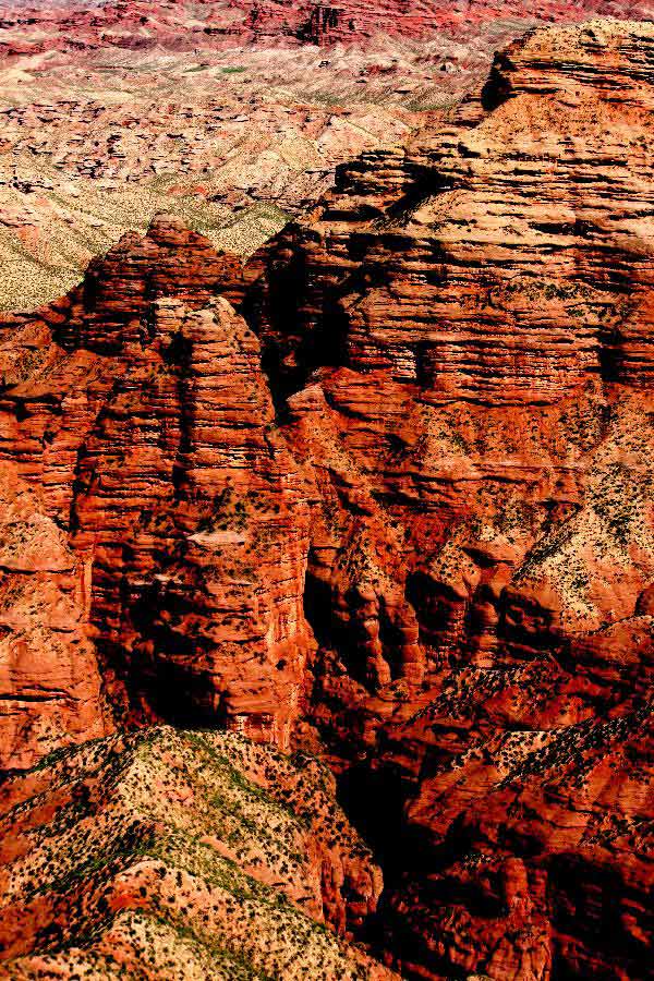 Photo taken on July 20, 2013 shows the scenery of Danxia landform at Pingshan Lake scenic area in Zhangye City, northwest China's Gansu Province. Danxia, which means "rosy cloud", is a special landform formed from reddish sandstone that has been eroded over time into a series of mountains surrounded by curvaceous cliffs and many unusual rock formations. (Xinhua/Wang Jiang)