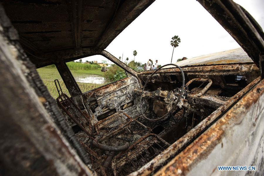 A vehicle destroyed by villagers whose children were killed in a mass food poisoning, is seen in the village of Gandaman, Saran District of eastern Indian state of Bihar, July 20, 2013. At least 23 children, all below 12 years, were confirmed dead due to food poisoning after eating a free mid-day school meal in the eastern Indian state of Bihar on July 16, 2013. (Xinhua/Zheng Huansong) 