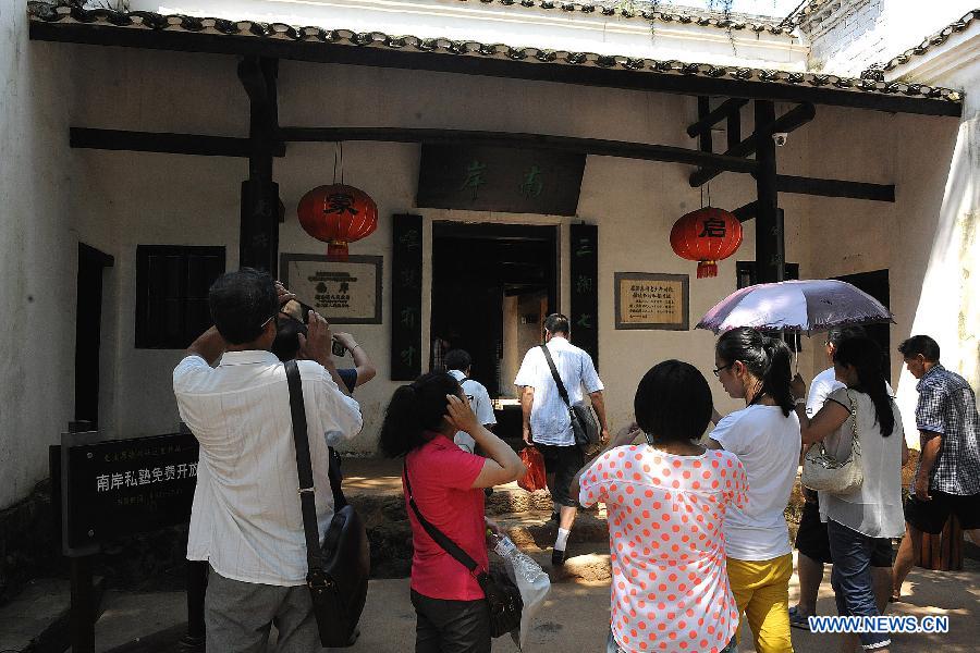 Tourists visit the Former Residence of Chairman Mao Zedong located in Shaoshan Township of Xiangtan City, central China's Hunan Province, July 19, 2013. This year marks the 120th Anniversary of Mao Zedong's Birth, many tourists come to the Former Residence of Chairman Mao Zedong which is a national site for patriotic education.(Xinhua/He Changjun)