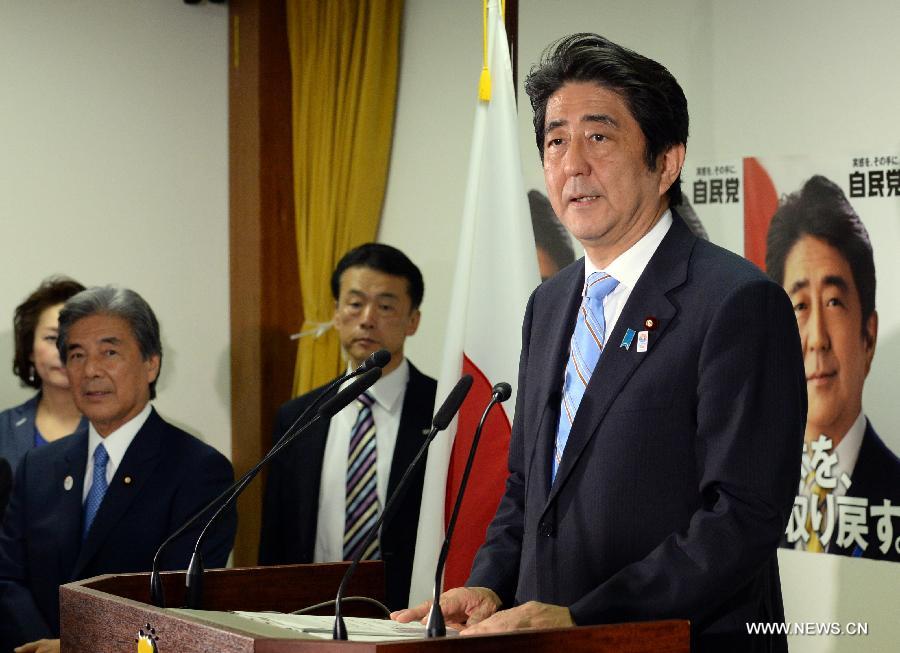 Japanese Prime Minister and ruling Liberal Democratic Party (LDP) leader Shinzo Abe attends a press conference at the LDP headquarters in Tokyo, Japan, July 22, 2013. (Xinhua/Ma Ping) 