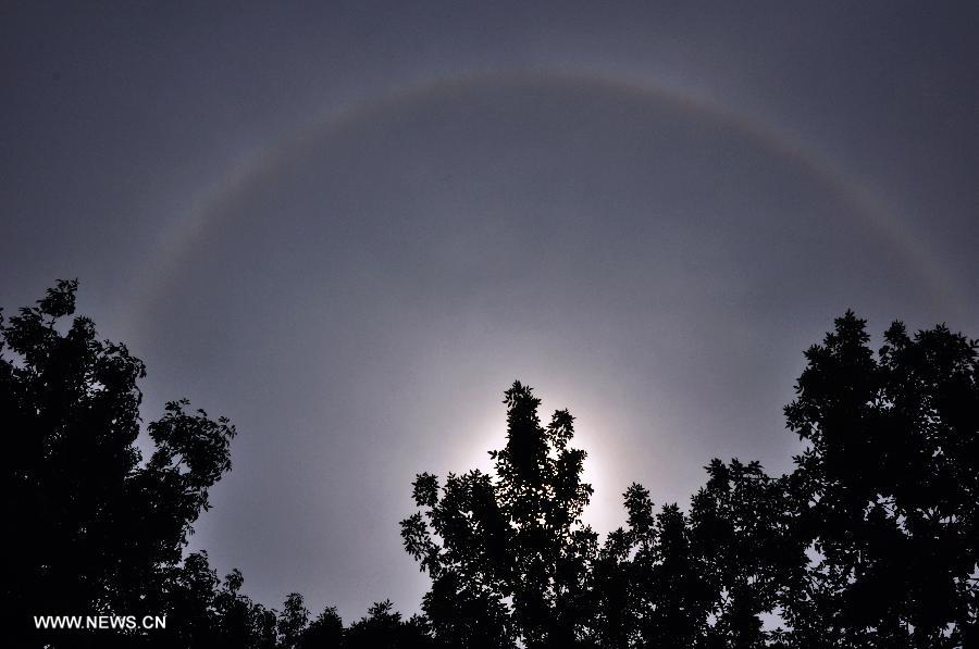 A solar halo occurs over the sky in Beijing, capital of China, July 22, 2013. (Xinhua/Wang Junfeng) 