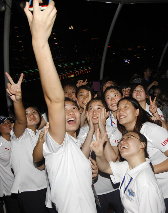 The athletes from Chinese delegation pose for photo at the closing ceremony of the fifth Sino-Russian Youth Games in Shanghai on July 14, 2013. (Xinhua/Ding Ding)