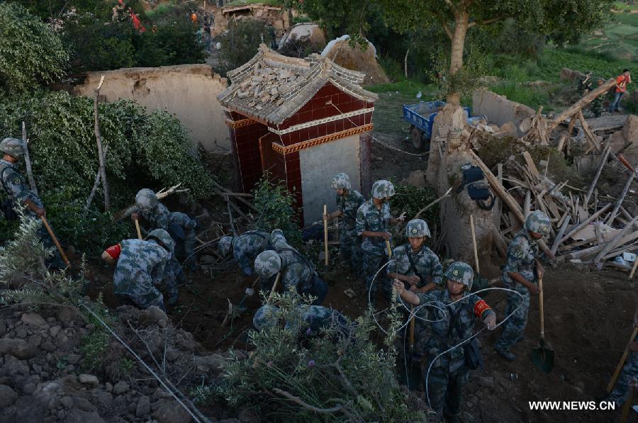 Rescuers work at Yongguang Village of Meichuan Town in Minxian County, northwest China's Gansu Province, July 22, 2013. The death toll has climbed to 89 in the 6.6-magnitude earthquake which jolted a juncture region of Minxian County and Zhangxian County in Dingxi City Monday morning. (Xinhua/Zhang Yongjin) 