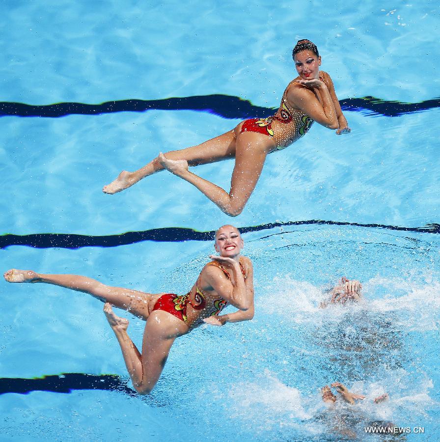 Team Ukraine competes in the Team Technical Finals of the Synchronised Swimming competition in the 15th FINA World Championships at Palau Sant Jordi in Barcelona, Spain, on July 22, 2013. Team Ukraine took the bronze with a total score of 93.300 points. (Xinhua/Wang Lili)