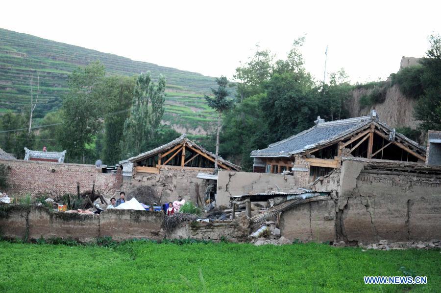 A collapsed house is pictured after a quake in Meichuan Town, Minxian County, northwest China's Gansu Province, July 22, 2013. A 6.6-magnitude quake jolted the border of Minxian and Zhangxian counties in Gansu at 7:45 a.m. on Monday. (Xinhua/Luo Xiaoguang)
