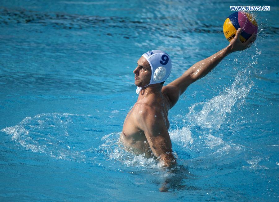 Hungary's Daniel Varga shoots during the preliminary round match of man's water polo competition against China in Barcelona, Spain, on July 22, 2013. Hungary won 13-5. (Xinhua/Xie Haining)