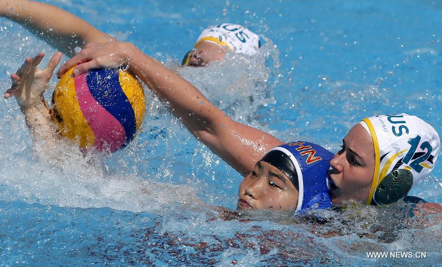 China's He Jin (L) vies with Australia's Nicola Zagame during the Women's Waterpolo Group B Preliminary Round match between China and Australia in the 15th FINA World Championships at Palau Sant Jordi in Barcelona, Spain, on July 23, 2013. China lost 5-14. (Xinhua/Wang Lili)