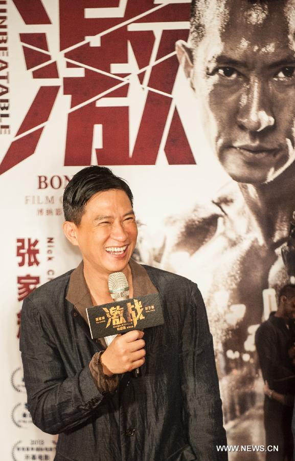 Actor Nick Cheung attends the press conference of the movie "Unbeatable" in Beijing, capital of China, July 23, 2013. The movie "Unbeatable" which won both the Golden Goblet for best actor and actress in the 16th Shanghai International Film Festival will hit the screen on Aug. 16. (Xinhua/Li Yan)