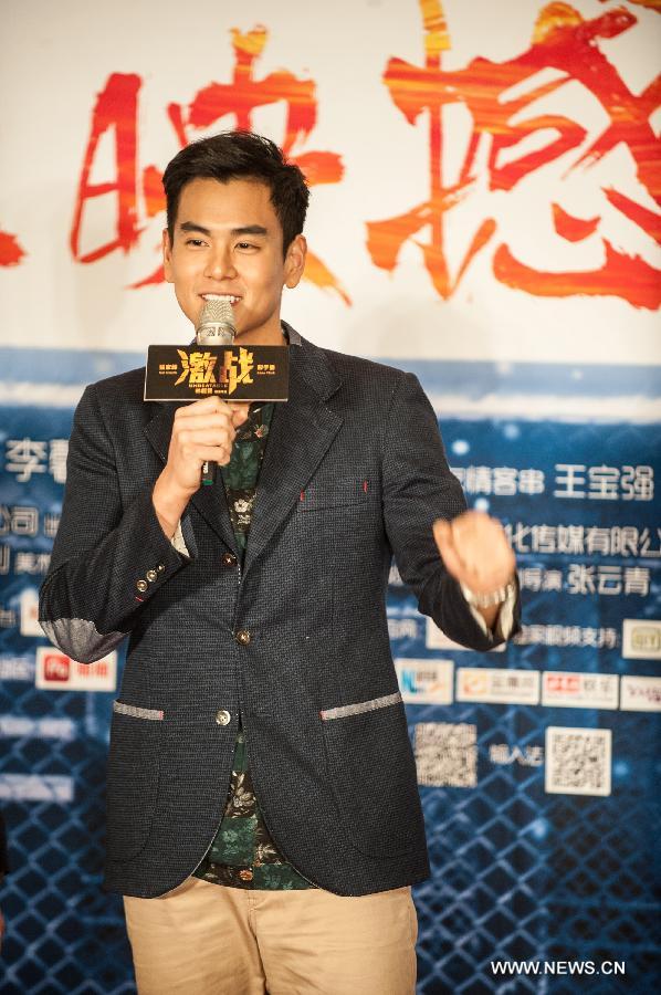 Actor Eddie Peng attends the press conference of the movie "Unbeatable" in Beijing, capital of China, July 23, 2013. The movie "Unbeatable" which won both the Golden Goblet for best actor and actress in the 16th Shanghai International Film Festival will hit the screen on Aug. 16. (Xinhua/Li Yan)