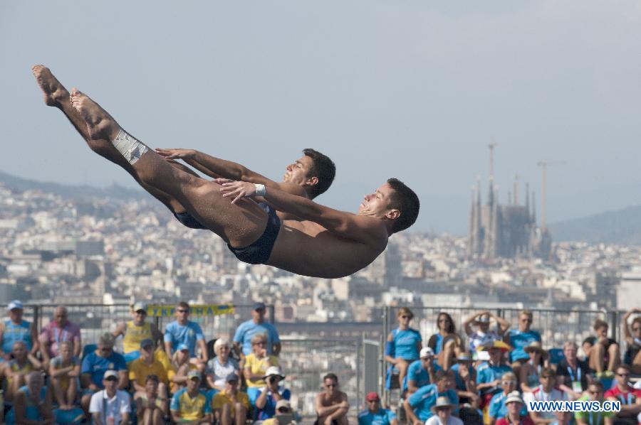 Andreas Billi and Giovanni Tocci of Italy compete during the men's 3m synchro springboard final of the diving competition at the 15th FINA World Championships in Barcelona, Spain, on July 23, 2013. Andreas Billi and Giovanni Tocci took the 12th place with a total score of 362.88 points. (Xinhua/Xie Haining)