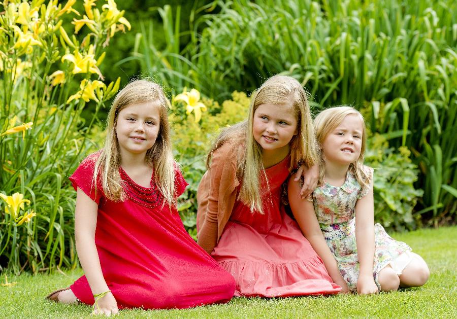 Crown Princess Catharina-Amalia of the Netherlands (C), Princess Alexia of the Netherlands (L) and Princess Ariane of the Netherlands (R) pose during the annual summer photocall at Horsten Estate on July 19, 2013 in Wassenaar, Netherlands. (Xinhua/AFP Photo)