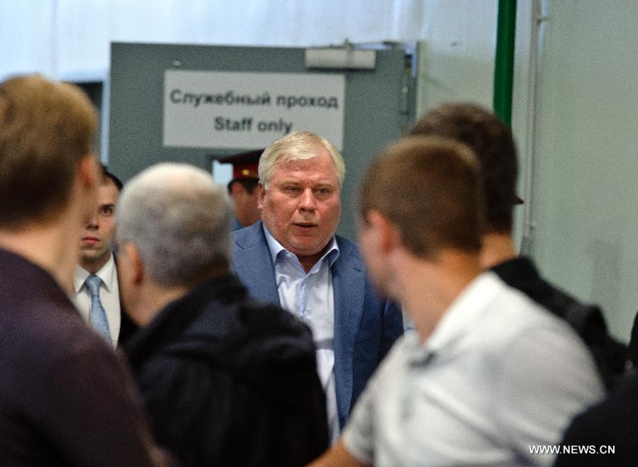 Lawyer Anatoly Kucherena walks to meet the media after meeting with fugitive U.S. intelligence whistleblower Edward Snowden at the Sheremetyevo Airport in Moscow, Russia, on July 24, 2013. Snowden can not leave the transit zone of the Sheremetyevo Airport as he was not granted a document from Russia's Federal Migration Service, a lawyer on behalf of Snowden said Wednesday. (Xinhua/Jiang Kehong)