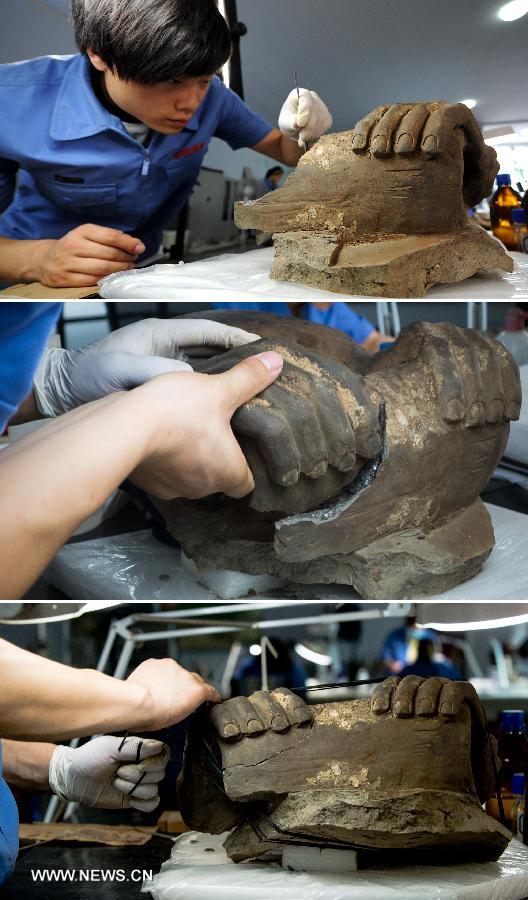 In this combination photo taken on July 18, 2013, an archeological worker repairs dilapidated pieces of a terracotta warrior at the Emperor Qinshihuang's Mausoleum Site Museum in Xi'an, capital of northwest China's Shaanxi Province. The 2,200-year-old mausoleum was discovered in Lintong District, 35 km east of Xi'an, in 1974 by peasants who were digging a well. The Chinese terracotta army buried around the mausoleum was one of the greatest archeological finds of modern times. (Xinhua) 