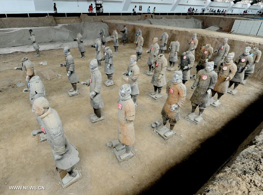 Repaired terracotta warriors are on display at the No. 1 Pit of the Emperor Qinshihuang's Mausoleum Site Museum in Xi'an, capital of northwest China's Shaanxi Province, July 18, 2013. The 2,200-year-old mausoleum was discovered in Lintong District, 35 km east of Xi'an, in 1974 by peasants who were digging a well. The Chinese terracotta army buried around the mausoleum was one of the greatest archeological finds of modern times. (Xinhua/Jiao Weiping) 