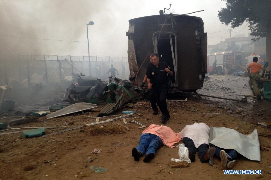 The bodies of three people remains in the site where a train crashed at entrance of Santiago de Compostela Station, autonomous community of Galicia, northwest of Spain, on July 24, 2013. Up to 35 people have died and around 100 injured after a train derailed just outside the city of Santiago de Compostela in the region of Galicia in north-western Spain on Wednesday evening.(Xinhua/La Voz de Galicia)