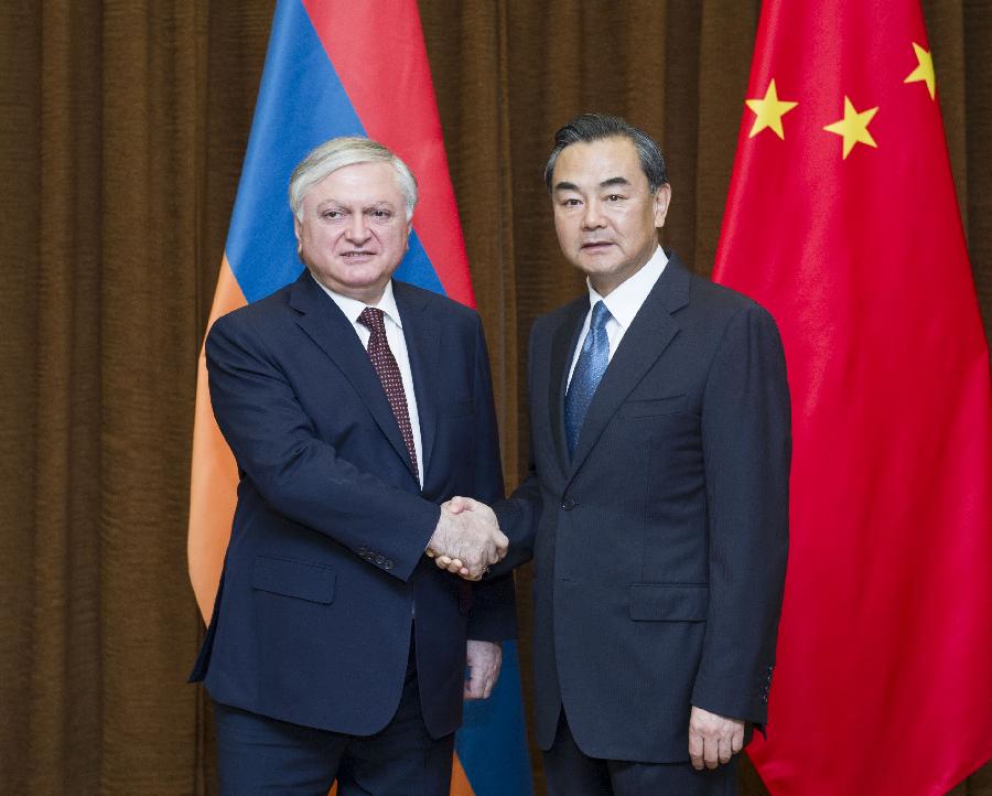 Chinese Foreign Minister Wang Yi (R) shakes hands with his Armenian counterpart Edward Nalbandian during their talks in Beijing, capital of China, July 25, 2013. (Xinhua/Wang Ye)