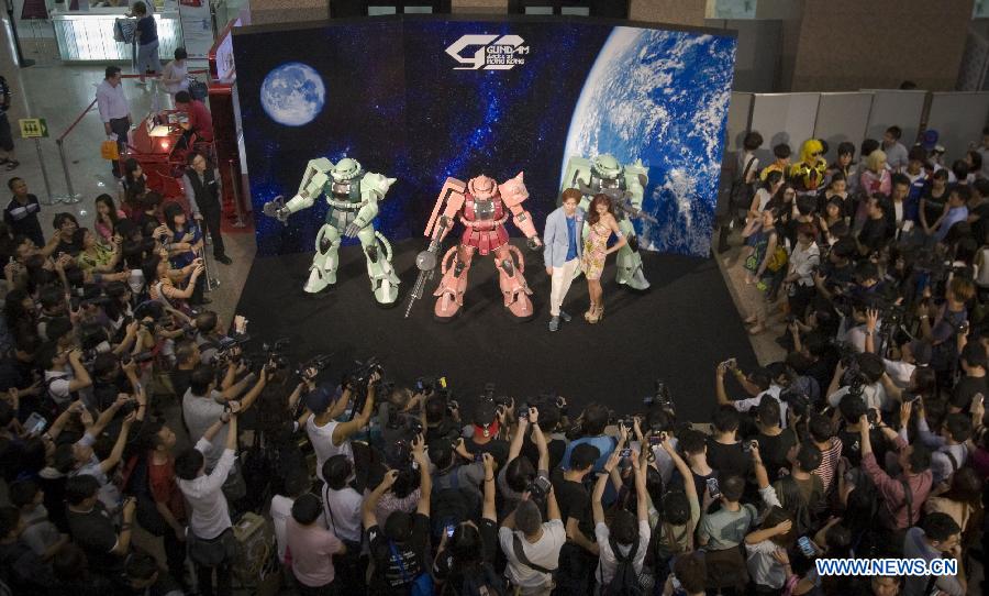 The opening event of the exhibition "Gundam Docks at Hong Kong" is held in Hong Kong, south China, July 25, 2013. The exhibition showcased some 100 models of the "Gundam" robots in Japan's TV animation. (Xinhua/He Jingjia)