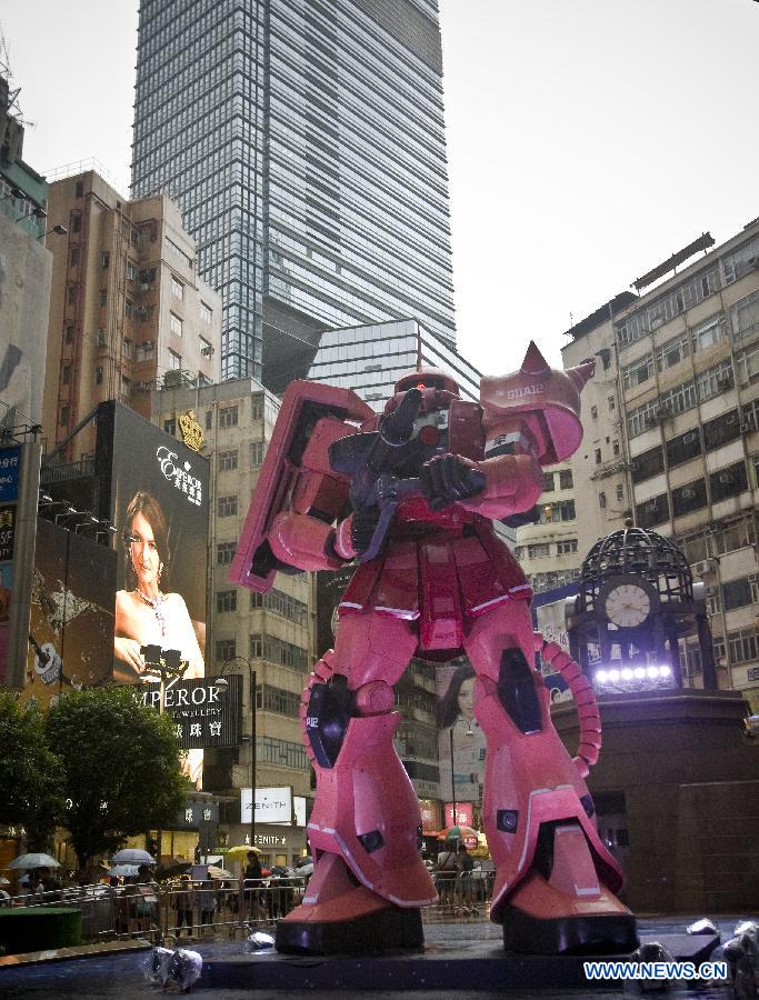 A six-meter-tall model of a "Gundam" robot in Japan's TV animation "is set up in Hong Kong, south China, July 25, 2013. The exhibition "Gundam Docks at Hong Kong" held its opening event here on Thursday, showcasing some 100 "Gundam" models. (Xinhua/He Jingjia)