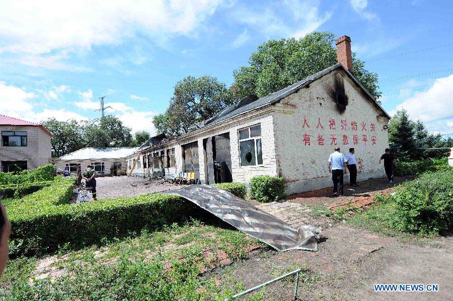 Photo taken on July 26, 2013 shows the accident site at the Lianhe Senior Nursing Home where a fire took place in Hailun City, northeast China's Heilongjiang Province. Eleven people were killed in the fire that occurred early Friday. Local police said arson has been confirmed as the cause of the fire. A total of 283 elderly people were living in the nursing home, which was built in October 2005. With an area of 7,000 square meters, it caters for the rural elderly in the city who have no source of income. (Xinhua/Wang Song)