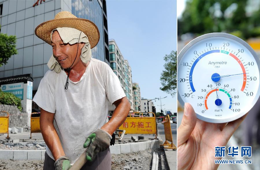 Worker Li constructs and maintains road in Hangzhou at 2:16 p.m. on July 24. The temperature was over 40 degree at that time. (Xinhua/ Ju Huanzong)