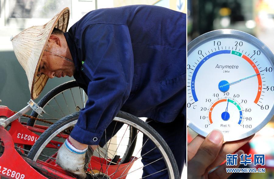 Chen repairs a bike outside at 8:10 am on July 24. He is a bicycle repairman who needs to maintain public bikes at more than 10 bike renting spots around Hangzhou city. He had 40 bikes to repair that day, and thermometer showed the temperature was 40 degree at that time.  (Xinhua/ Ju Huanzong) 